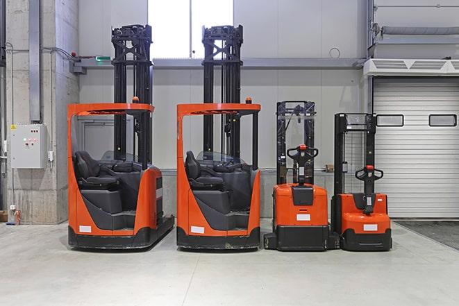 warehouse forklifts moving pallets